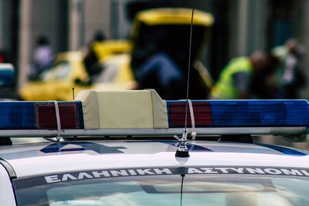 Athens Greece September 12, 2019 View of a Greek police car driving through the streets of Athens in the eveningの写真素材
