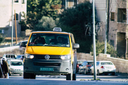 Palestinian Territory Bethlehem December 16, 2019 View of yellow Palestinian taxi rolling in the...