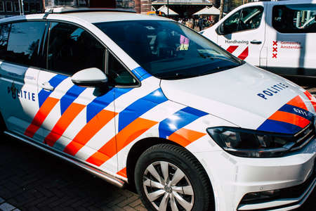Amsterdam Netherlands April 8, 2019 View of a Dutch police car parked in the streets of Amsterdam in the afternoonのeditorial素材