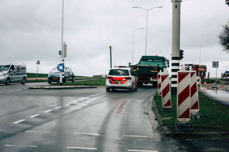 Papendrecht Netherlands March 12, 2019 View of a Duch police car rolling in the streets of Papendrecht in the afternoonのeditorial素材
