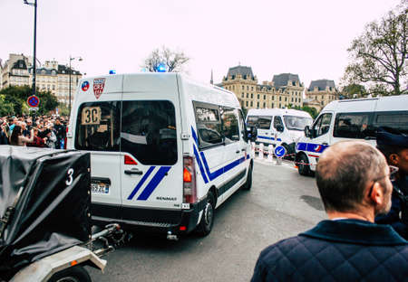 Paris France April 16, 2019 View of a French police car near the Notre Dame cathedral in Paris the day after the big fire in the afternoonのeditorial素材