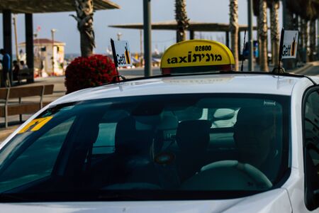 Tel Aviv Israel July 11, 2019 View of traditional Israeli taxi rolling in the streets of Tel Aviv in the afternoonの写真素材