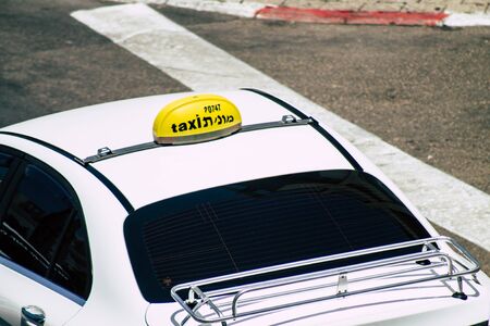 Tel Aviv Israel July 16, 2019 View of traditional Israeli taxi rolling in the streets of Tel Aviv in the afternoonの写真素材