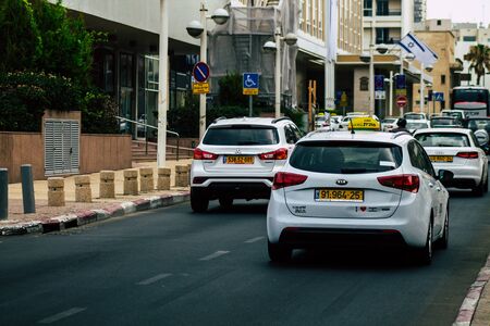 Tel Aviv Israel July 11, 2019 View of traditional Israeli taxi rolling in the streets of Tel Aviv in the afternoonの写真素材