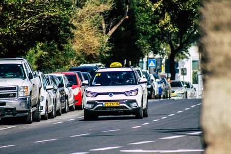 Tel Aviv Israel February 04, 2020 View of traditional Israeli taxi rolling in the streets of Tel Aviv in the afternoonの写真素材