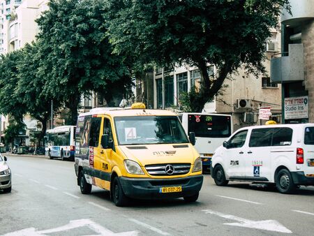 Tel Aviv Israel December 21, 2018 View of a traditional Israeli taxi rolling in the streets of Tel Aviv in the afternoonの写真素材