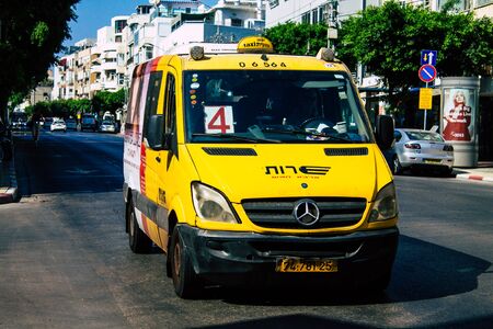 Tel Aviv Israel July 11, 2019 View of traditional Israeli taxi rolling in the streets of Tel Aviv in the afternoonの写真素材