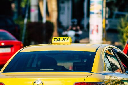 Athens Greece September 7, 2019 View of Greek yellow taxi driving through the streets of Athens in the morningの写真素材