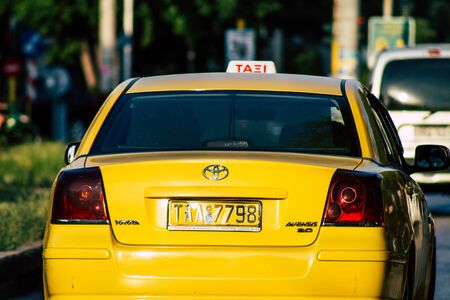 Athens Greece September 7, 2019 View of Greek yellow taxi driving through the streets of Athens in...
