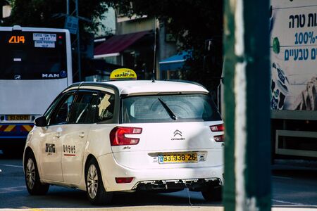 Tel Aviv Israel January 06, 2020 View of traditional Israeli taxi rolling in the streets of Tel Aviv in the afternoonの写真素材