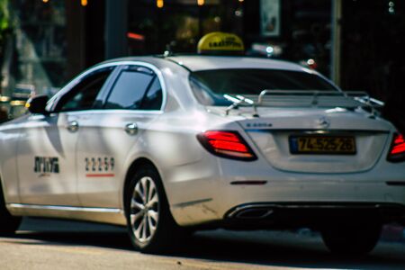 Tel Aviv Israel January 23, 2020 View of traditional Israeli taxi rolling in the streets of Tel Aviv in the afternoonの写真素材