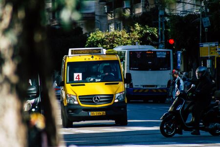 Tel Aviv Israel January 06, 2020 View of traditional Israeli taxi rolling in the streets of Tel Aviv in the afternoonの写真素材
