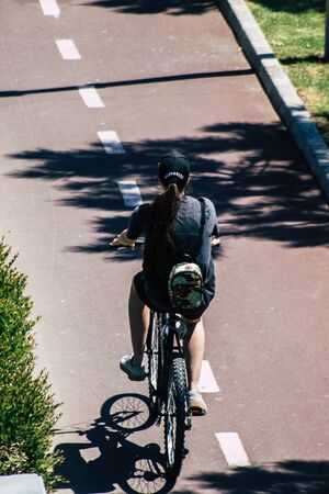 Limassol Cyprus May 10, 2020 View of unidentfied people rolling with a bicycle in the streets of Limassol in the afternoonの写真素材