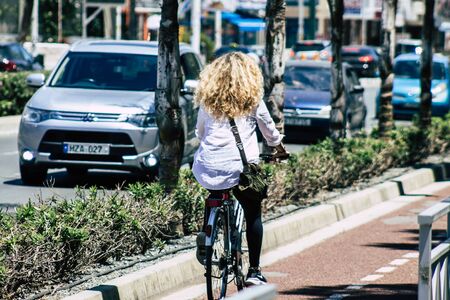 Limassol Cyprus May 10, 2020 View of unidentfied people rolling with a bicycle in the streets of Limassol in the afternoonの写真素材