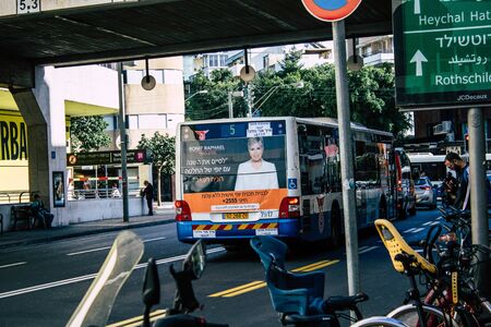Tel Aviv Israel December 02, 2019 View of a traditional Israeli public city bus rolling in the streets of Tel Aviv in in the afternoonの写真素材