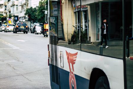 Tel Aviv Israel January 28, 2020 View of a traditional Israeli public city bus rolling in the streets of Tel Aviv in in the afternoonの写真素材