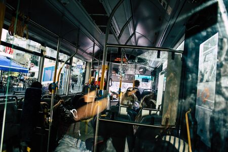 Tel Aviv Israel November 05, 2019 View of unknowns Israeli people travelling in a public bus of the city of Tel Aviv in the afternoonの写真素材