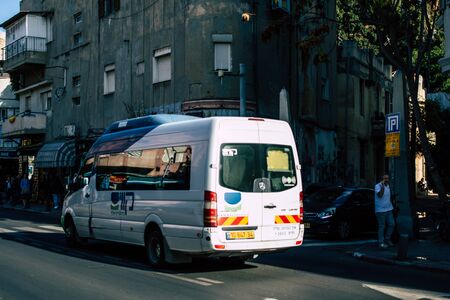 Tel Aviv Israel December 02, 2019 View of a traditional Israeli public city bus rolling in the streets of Tel Aviv in in the afternoonの写真素材