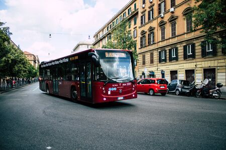 Rome Italy October 18, 2019 View of a public bus rolling through the streets of Rome in the eveningの写真素材