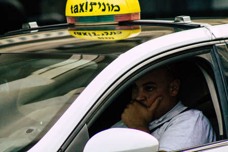 Tel Aviv Israel June 10, 2019 View of traditional taxi rolling in the streets of Tel Aviv in the afternoonのeditorial素材