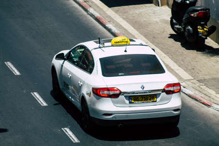 Tel Aviv Israel July 16, 2019 View of traditional Israeli taxi rolling in the streets of Tel Aviv in the afternoonのeditorial素材