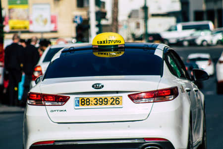 Tel Aviv Israel December 07, 2019 View of traditional Israeli taxi rolling in the streets of Tel Aviv in the afternoonのeditorial素材