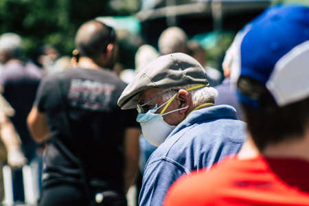 Limassol Cyprus May 09, 2020 View of an unidentified people with a face mask to protect themselves from the coronavirus shopping in the Limassol market in the morningのeditorial素材