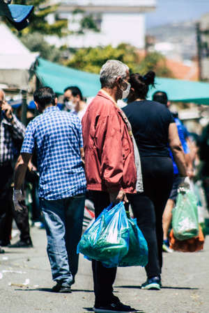 Limassol Cyprus May 09, 2020 View of an unidentified people with a face mask to protect themselves from the coronavirus shopping in the Limassol market in the morningのeditorial素材