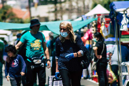 Limassol Cyprus May 09, 2020 View of an unidentified people with a face mask to protect themselves from the coronavirus shopping in the Limassol market in the morningのeditorial素材