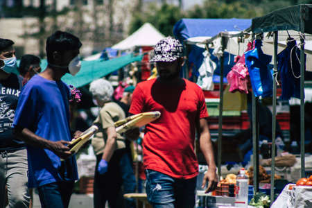 Limassol Cyprus May 09, 2020 View of an unidentified people with a face mask to protect themselves from the coronavirus shopping in the Limassol market in the morningのeditorial素材
