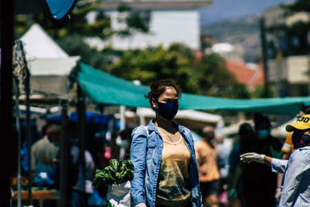 Limassol Cyprus May 09, 2020 View of an unidentified people with a face mask to protect themselves from the coronavirus shopping in the Limassol market in the morningのeditorial素材
