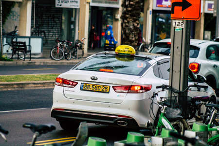 Tel Aviv Israel February 11, 2020 View of traditional Israeli taxi rolling in the streets of Tel Aviv in the afternoonのeditorial素材