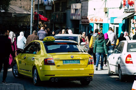 Palestinian Territory Bethlehem December 16, 2019 View of yellow Palestinian taxi rolling in the streets of Bethlehem in the afternoonのeditorial素材