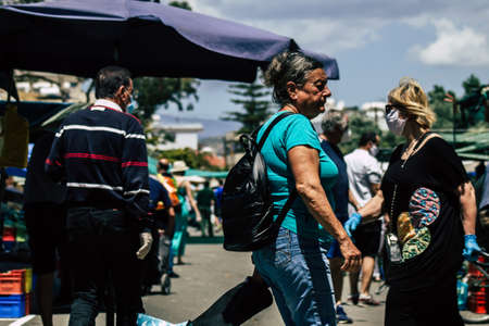 Limassol Cyprus May 09, 2020 View of an unidentified people without a face mask to protect themselves from the coronavirus shopping in the Limassol market in the morningのeditorial素材