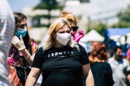 Limassol Cyprus May 09, 2020 View of an unidentified people with a face mask to protect themselves from the coronavirus shopping in the Limassol market in the morningのeditorial素材