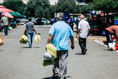 Limassol Cyprus May 09, 2020 View of an unidentified people without a face mask to protect themselves from the coronavirus shopping in the Limassol market in the morningのeditorial素材