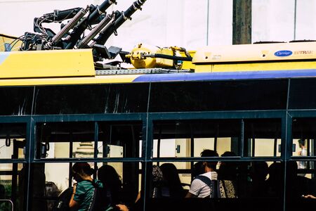 Athens Greece August 30, 2019 View of a electic Greek public bus rolling through the streets of Athens in the morningの写真素材