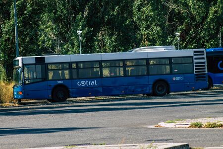 Rome Italy September 15, 2019 View of blue public buses parked at the bus stand in Rome in the morningの写真素材