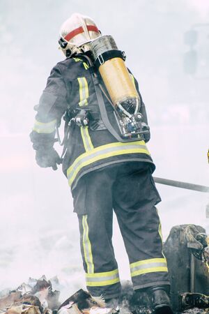 Reims France May 18, 2019 View of firefighters extinguishing a construction hut burned by rioters during protests of the Yellow Jackets in the streets of Reims on saturday afternoonの写真素材