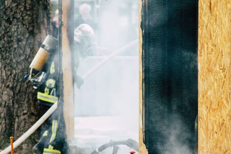 Reims France May 18, 2019 View of firefighters extinguishing a construction hut burned by rioters...