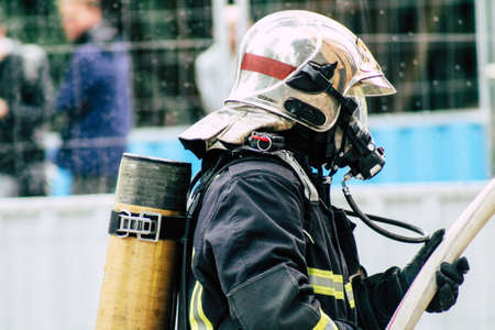 Reims France May 18, 2019 View of firefighters extinguishing a construction hut burned by rioters during protests of the Yellow Jackets in the streets of Reims on saturday afternoonのeditorial素材