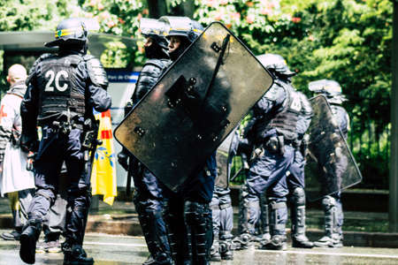 Paris France May 11, 2019 View of a riot squad of the French National Police in intervention during protests of the Yellow Jackets against the policy of President Macron in Paris on saturday afternoonのeditorial素材