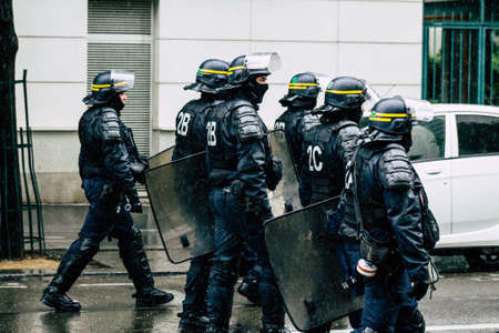 Paris France May 11, 2019 View of a riot squad of the French National Police in intervention during protests of the Yellow Jackets against the policy of President Macron in Paris on saturday afternoonのeditorial素材
