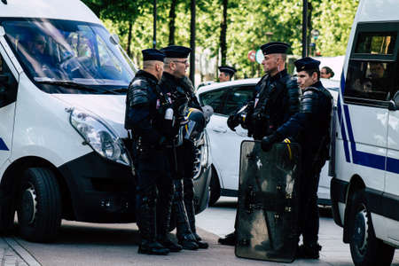 Paris France May 11, 2019 View of a riot squad of the French National Police in intervention during protests of the Yellow Jackets against the policy of President Macron in Paris on saturday afternoonのeditorial素材