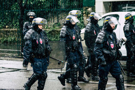 Paris France May 11, 2019 View of a riot squad of the French National Police in intervention during protests of the Yellow Jackets against the policy of President Macron in Paris on saturday afternoonのeditorial素材