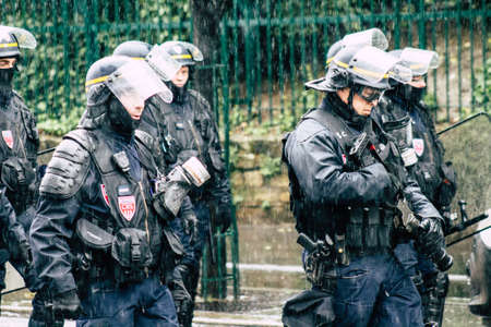 Paris France May 11, 2019 View of a riot squad of the French National Police in intervention during protests of the Yellow Jackets against the policy of President Macron in Paris on saturday afternoonのeditorial素材