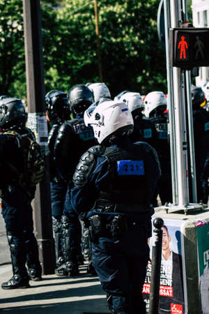 Paris France May 04, 2019 View of a riot squad of the French National Police in intervention during protests of the Yellow Jackets against the policy of President Macron in Paris on saturday afternoonのeditorial素材