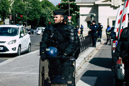 Paris France May 04, 2019 View of a riot squad of the French National Police in intervention during protests of the Yellow Jackets against the policy of President Macron in Paris on saturday afternoonのeditorial素材