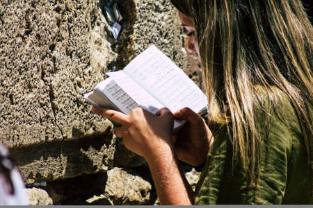 Jerusalem Israel June 24, 2019 View of unknown Israeli woman praying at the Western wall in the Old city of Jerusalem in the afternoonのeditorial素材
