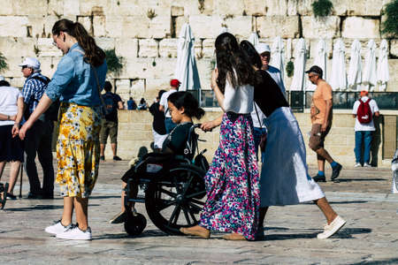 Jerusalem Israel June 19, 2019 View of unknown Israeli woman praying at the Western wall in the Old city of Jerusalem in the afternoonのeditorial素材